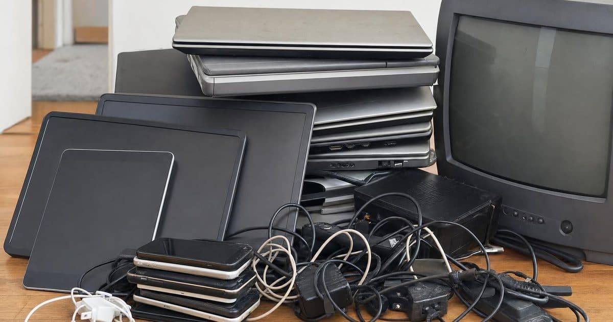 Old electronic devices and cables sorted for recycling in Swindon